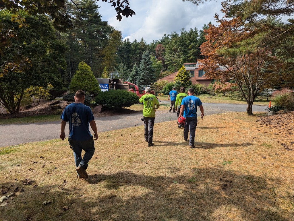 C&G Outdoor Services team walking to a property job site