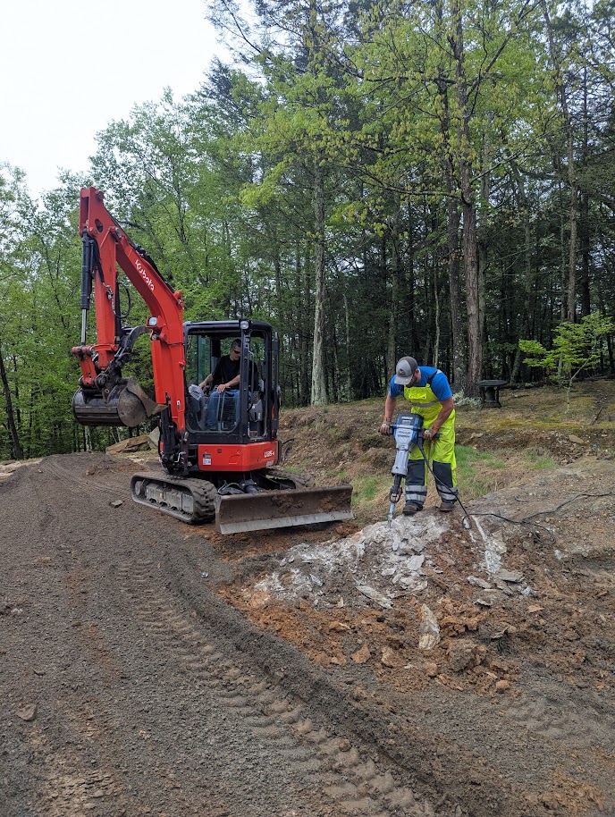C&G Outdoor Services heavy excavation equipment preparing a residential site in Newtown, CT.