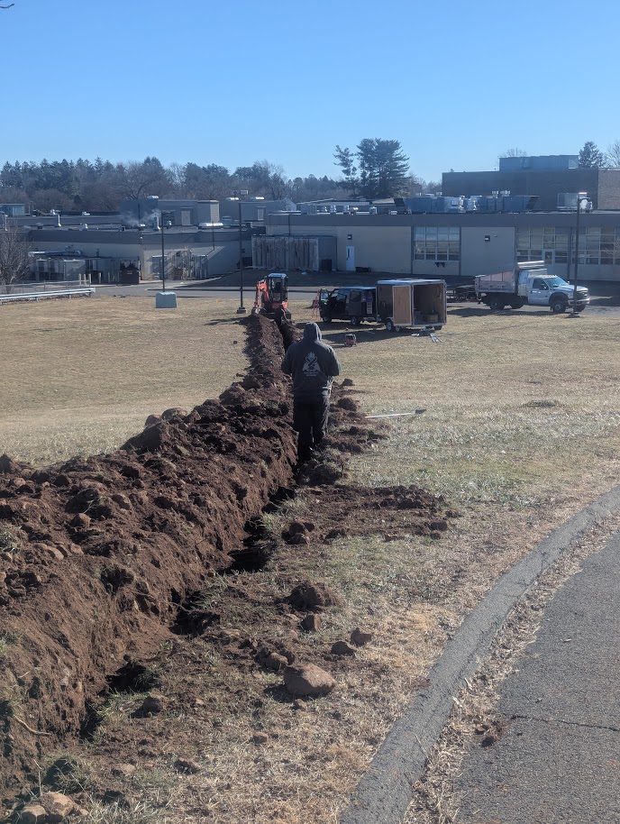 Precision trenching for underground drainage pipes and utility line installation.