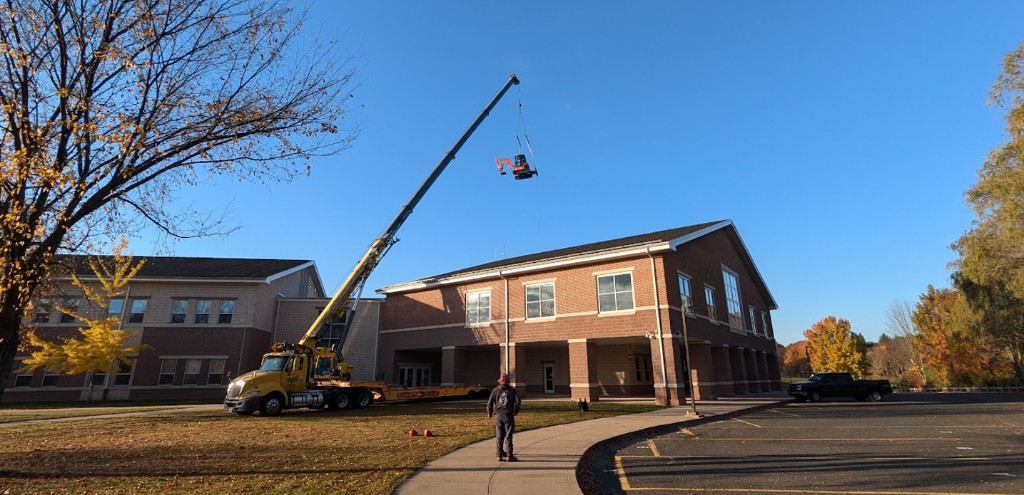 Crane-assisted arborist equipment project at a commercial property in Connecticut